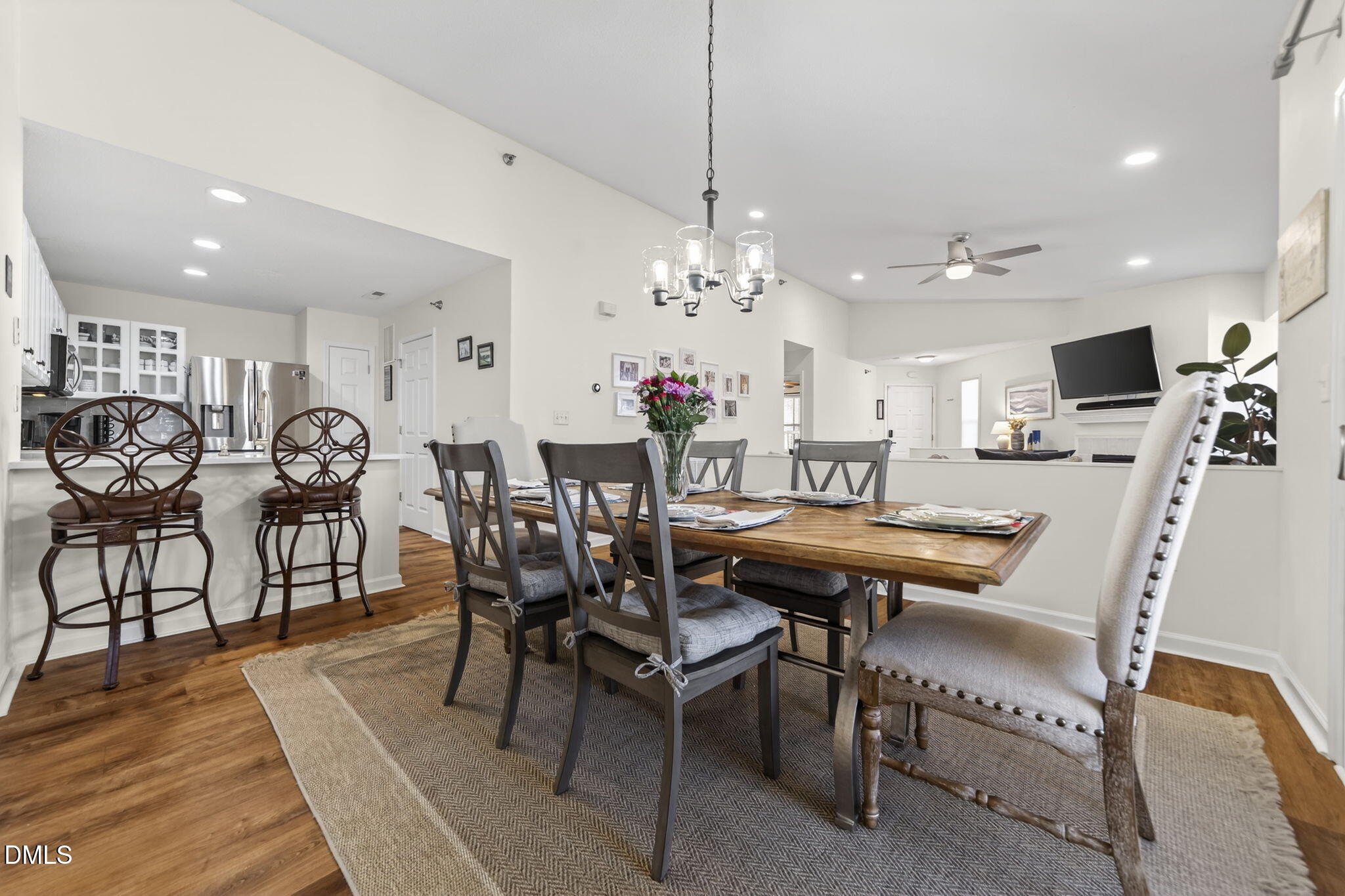 1911 Falls Landing Drive, Unit 203 Raleigh, NC 27614 - Photo 12 of 39 a view of a dining room with furniture and wooden floor
