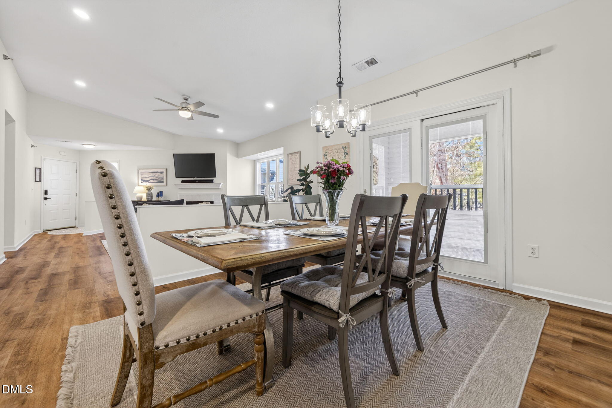 1911 Falls Landing Drive, Unit 203 Raleigh, NC 27614 - Photo 13 of 39 a view of a dining room with furniture and chandelier