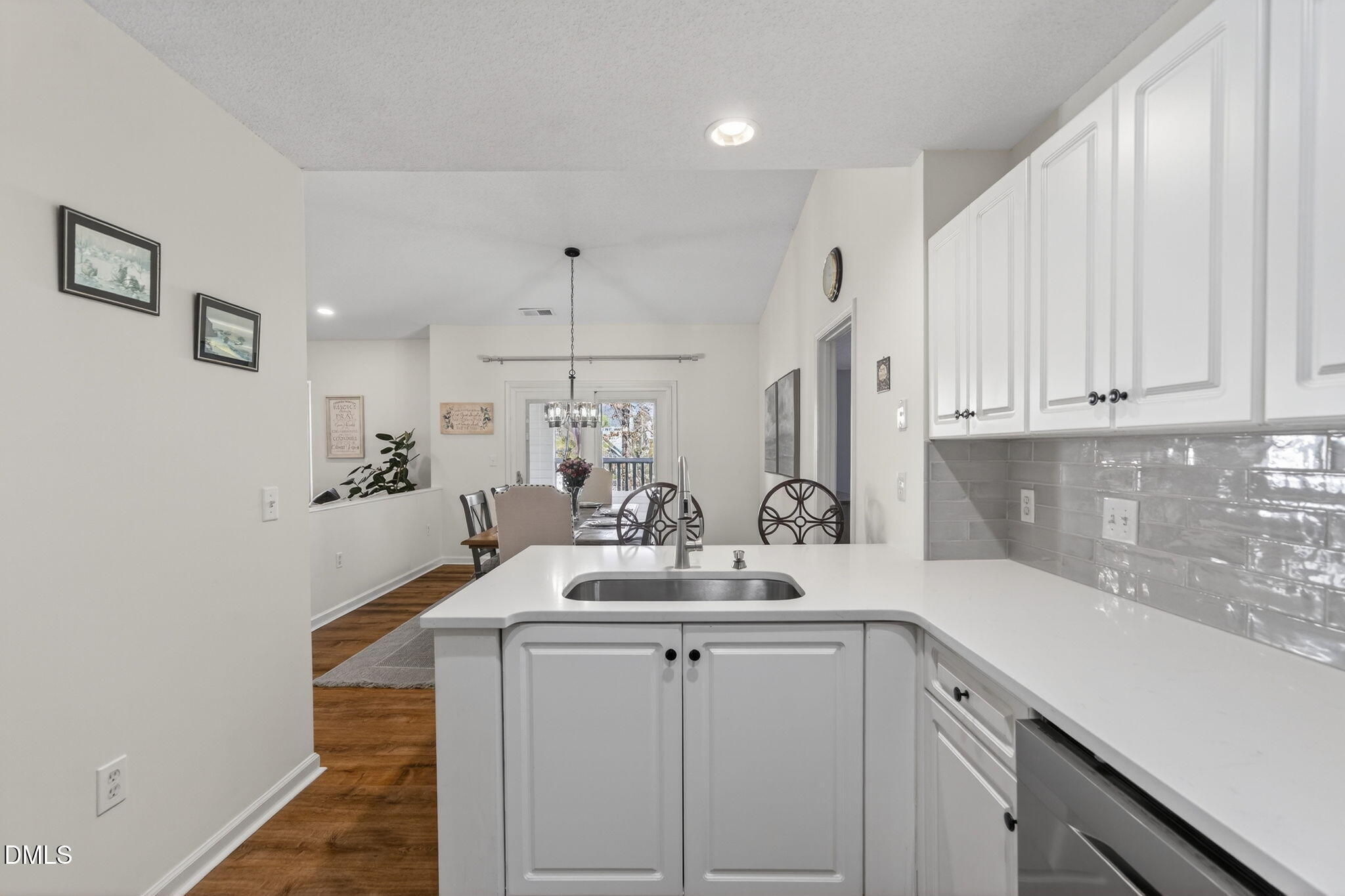 1911 Falls Landing Drive, Unit 203 Raleigh, NC 27614 - Photo 18 of 39 a kitchen with sink a cabinets and window