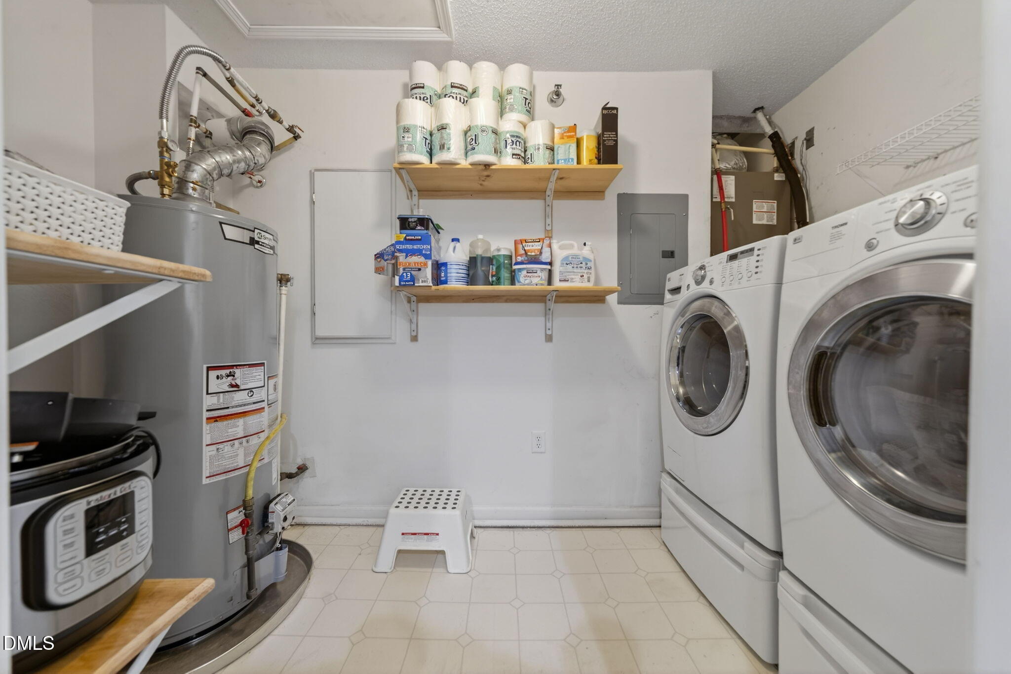 1911 Falls Landing Drive, Unit 203 Raleigh, NC 27614 - Photo 20 of 39 a view of a storage & utility room with a washer dryer