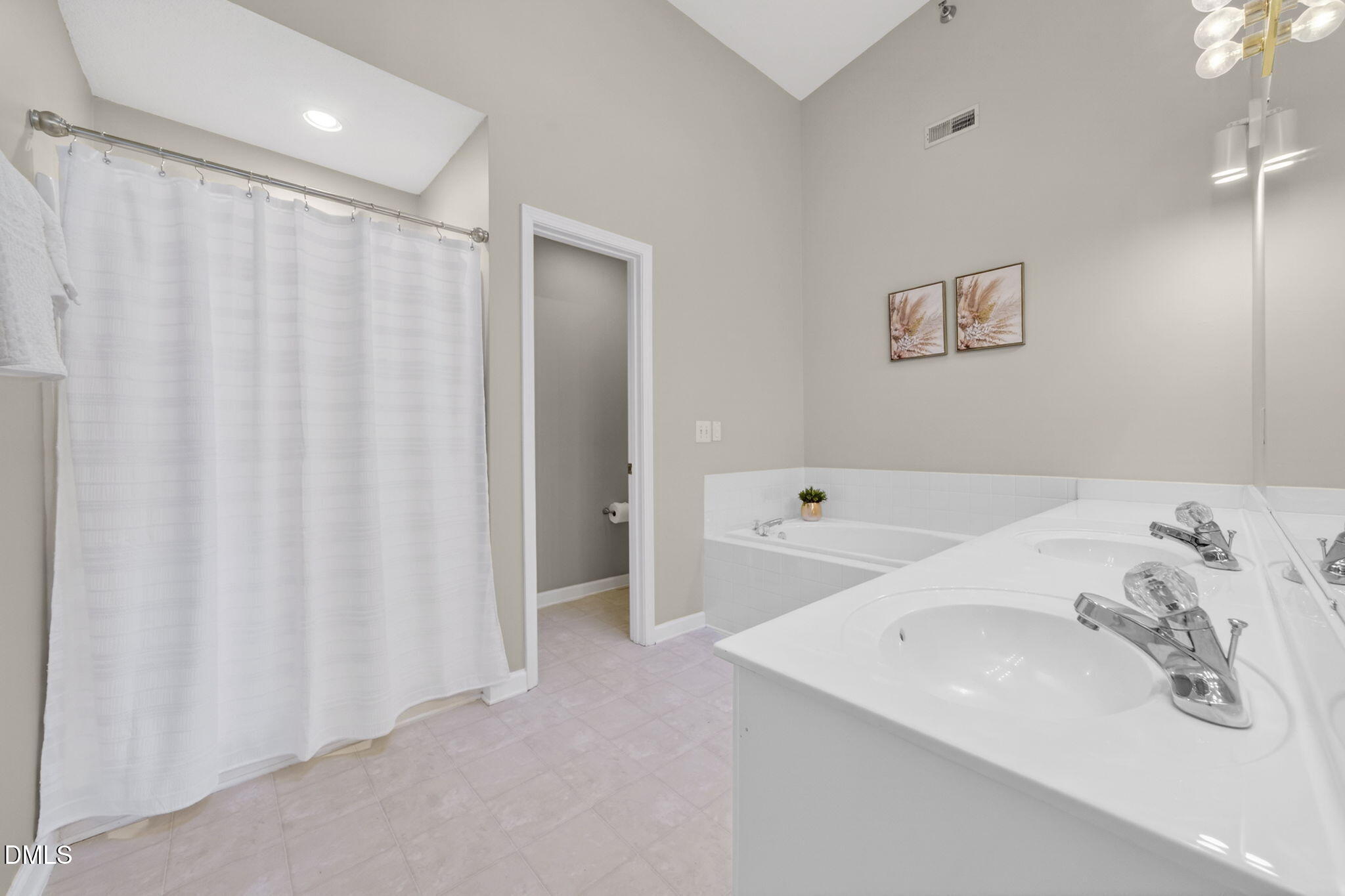 1911 Falls Landing Drive, Unit 203 Raleigh, NC 27614 - Photo 24 of 39 a bathroom with a sink a bathtub and a shower
