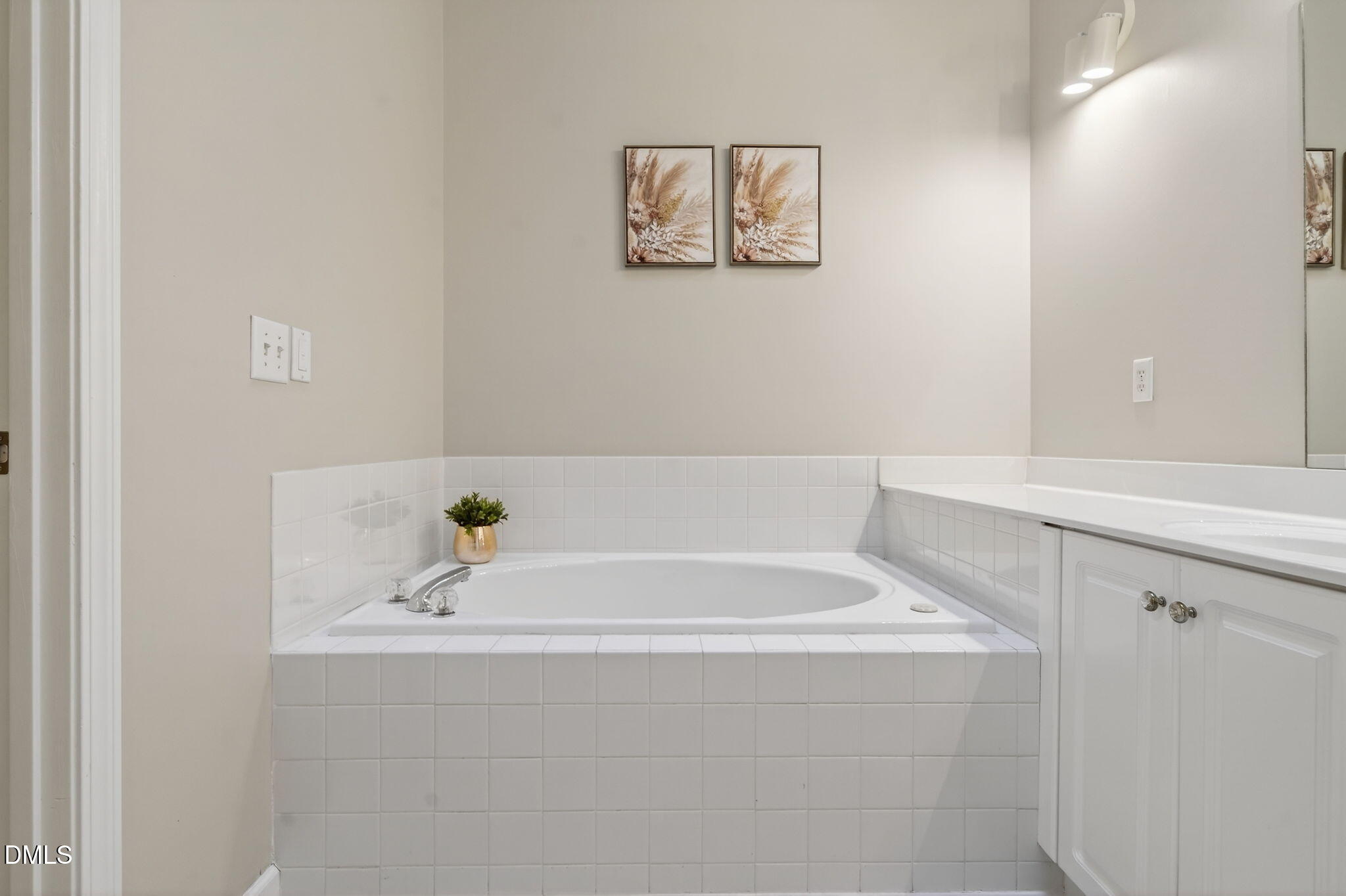 1911 Falls Landing Drive, Unit 203 Raleigh, NC 27614 - Photo 26 of 39 a bathroom with a bathtub