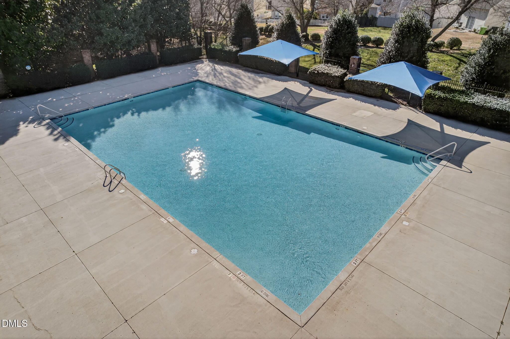 1911 Falls Landing Drive, Unit 203 Raleigh, NC 27614 - Photo 34 of 39 a view of a pool in the backyard of house