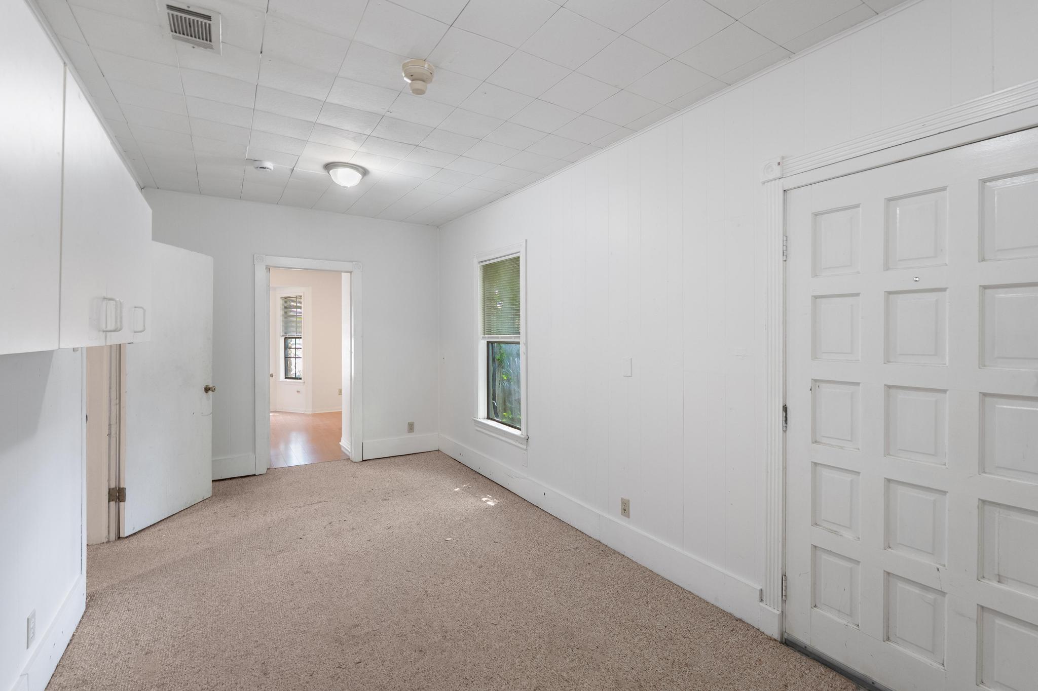 4616 East Cesar Chavez Street Austin, TX 78702 - Photo 7 of 22 an empty room with windows and closet