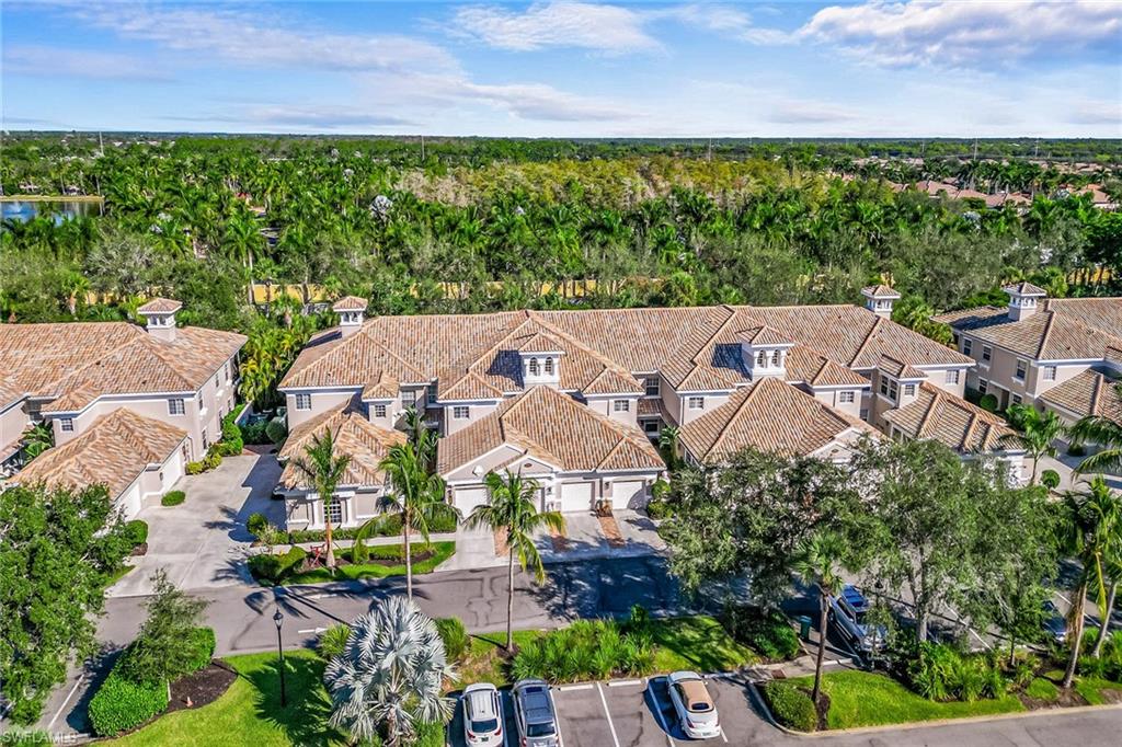 3985 Deer Crossing Court, Unit 103 Naples, FL 34114 - Photo 22 of 37 an aerial view of multiple house