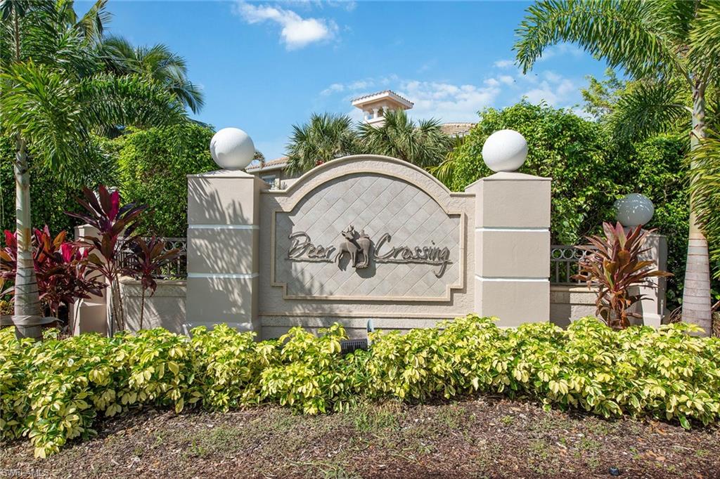 3985 Deer Crossing Court, Unit 103 Naples, FL 34114 - Photo 23 of 37 a front view of a house with garden
