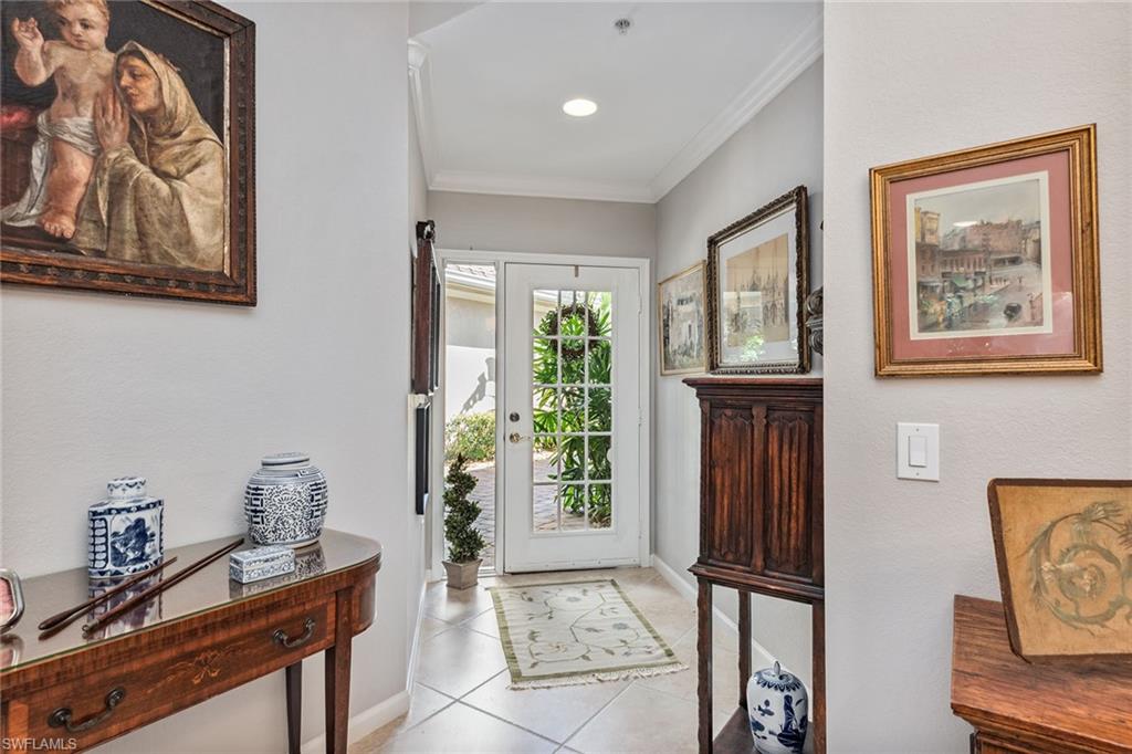 3985 Deer Crossing Court, Unit 103 Naples, FL 34114 - Photo 3 of 37 a view of room with window and furniture
