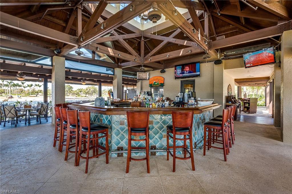 3985 Deer Crossing Court, Unit 103 Naples, FL 34114 - Photo 31 of 37 a view of a bar restaurant