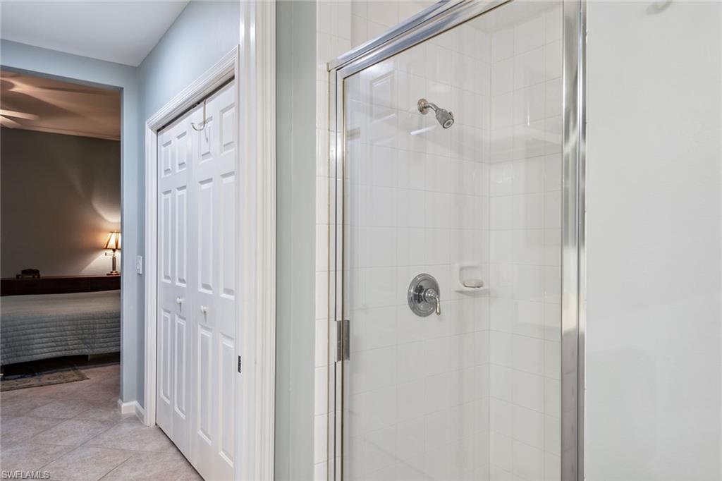 3985 Deer Crossing Court, Unit 103 Naples, FL 34114 - Photo 10 of 37 a bathroom with a shower