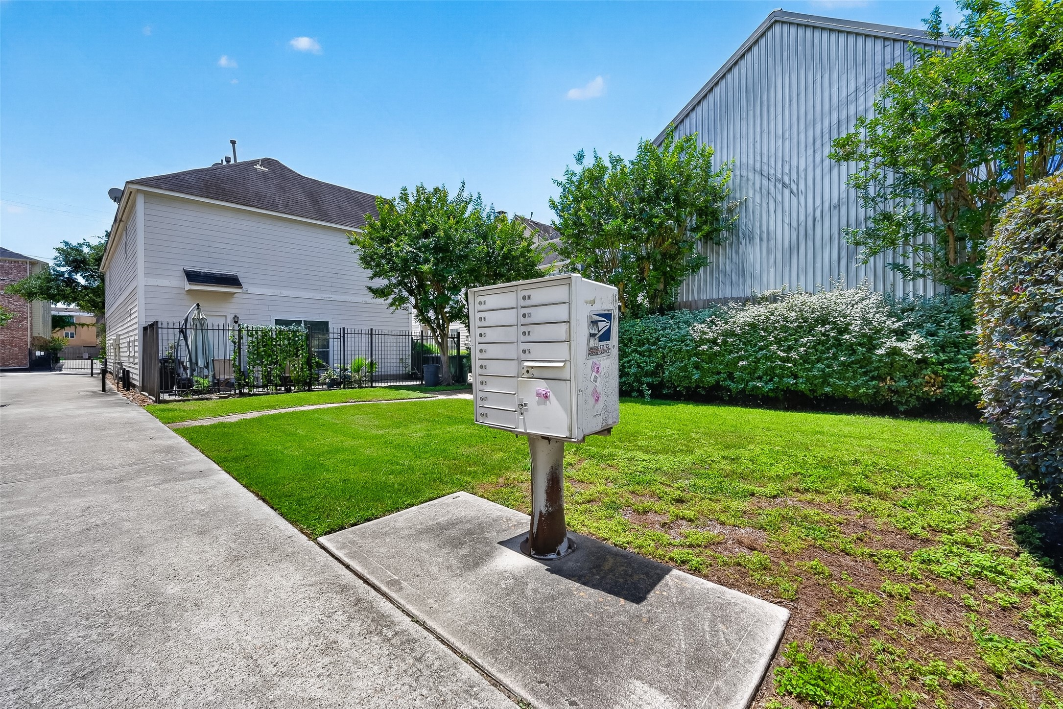 2804 Chenevert Street Houston, TX 77004 - Photo 36 of 37 a front view of a house with a yard and large tree