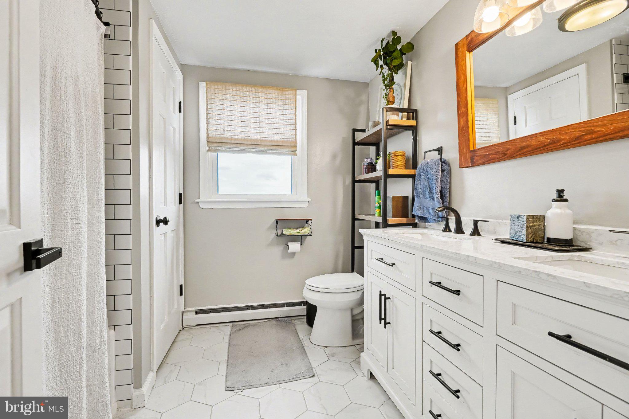 369 Dunkel School Road Halifax, PA 17032 - Photo 18 of 33 a bathroom with a sink a toilet and a mirror
