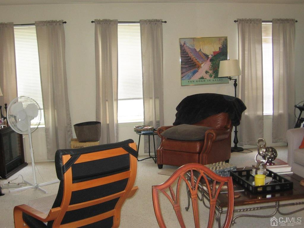 1708 Ridgeview Court Sayreville, NJ 08859 - Photo 13 of 24 a living room with furniture a fireplace and a window