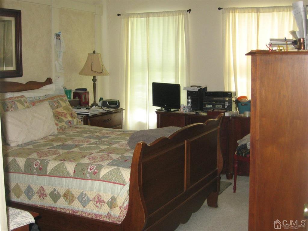 1708 Ridgeview Court Sayreville, NJ 08859 - Photo 14 of 24 a view of a workspace with furniture and a window