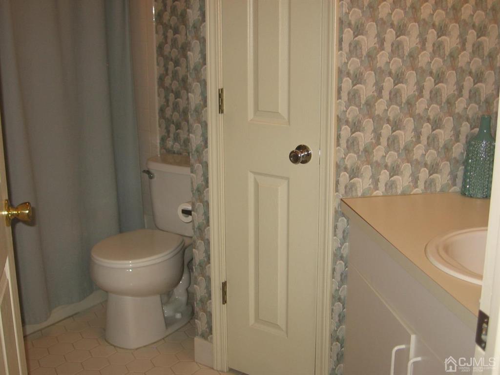 1708 Ridgeview Court Sayreville, NJ 08859 - Photo 20 of 24 a bathroom with a sink and toilet