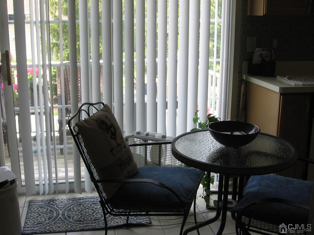1708 Ridgeview Court Sayreville, NJ 08859 - Photo 3 of 24 a view of a dining room with furniture and wooden floor