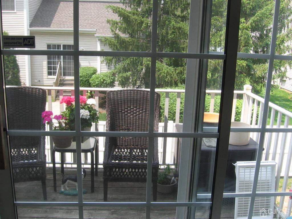1708 Ridgeview Court Sayreville, NJ 08859 - Photo 4 of 24 a front view of a dining room with floor to ceiling windows and a basket ball poll