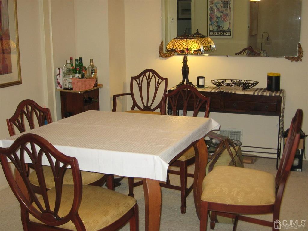 1708 Ridgeview Court Sayreville, NJ 08859 - Photo 10 of 24 a view of a dining room with furniture and chandelier