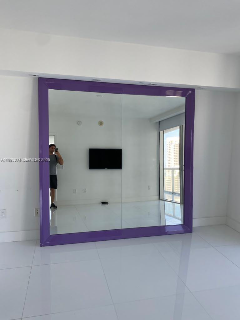 495 Brickell Avenue, Unit 2902 Miami, FL 33131 - Photo 12 of 31 a view of a livingroom with a projector
