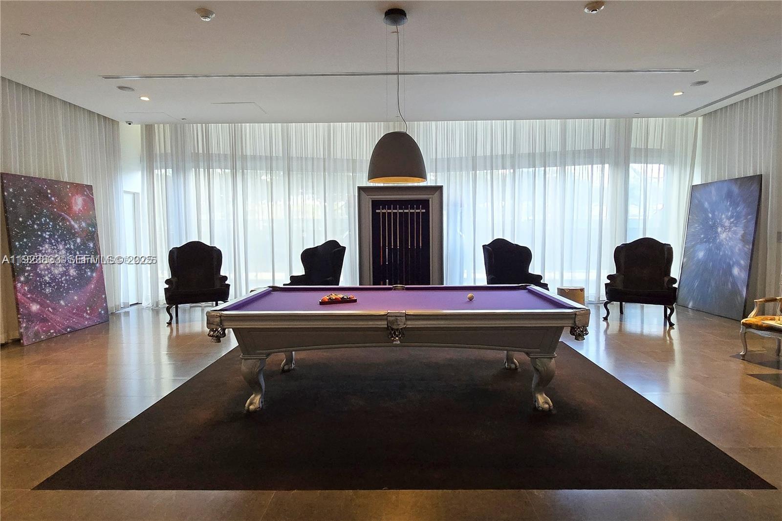 495 Brickell Avenue, Unit 2902 Miami, FL 33131 - Photo 26 of 31 a living room with a table chairs and a window