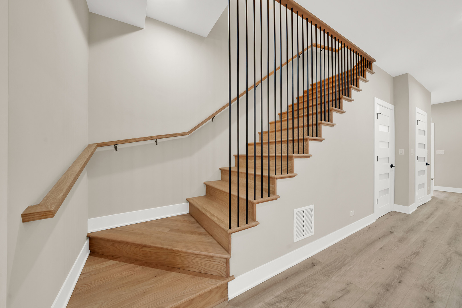 5901 West Erie Street Chicago, IL 60644 - Photo 17 of 38 a view of entryway and hall with wooden floor