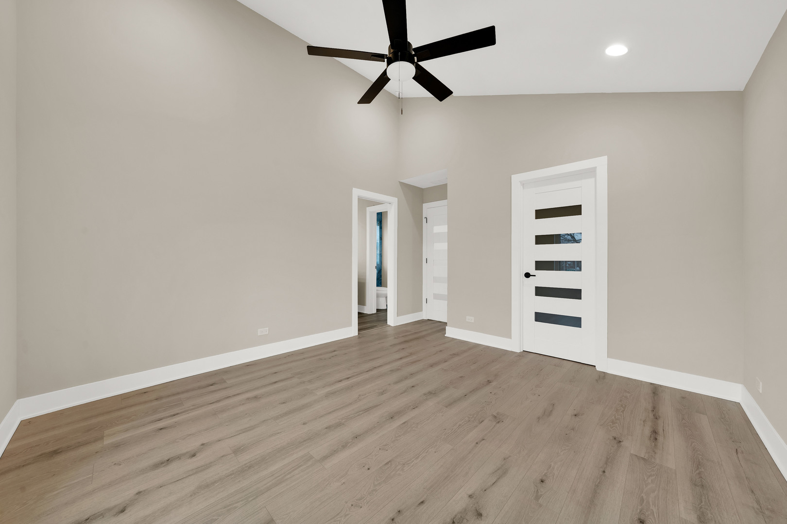 5901 West Erie Street Chicago, IL 60644 - Photo 21 of 38 a view of a big room with wooden floor and windows