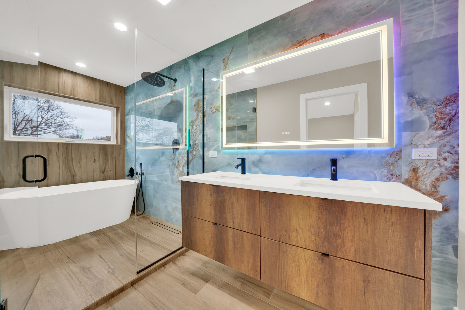 5901 West Erie Street Chicago, IL 60644 - Photo 23 of 38 a bathroom with a tub sink and mirror