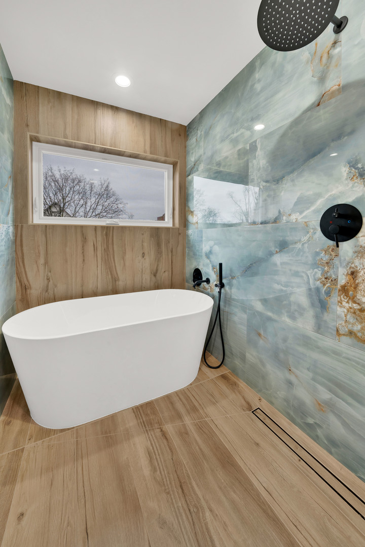 5901 West Erie Street Chicago, IL 60644 - Photo 24 of 38 a bathroom with a bathtub