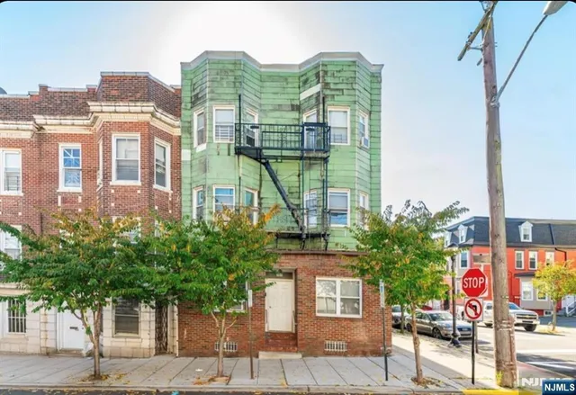 a front view of a building with street view