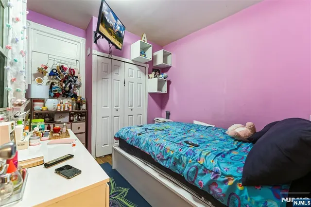 a bedroom with bed and a bed