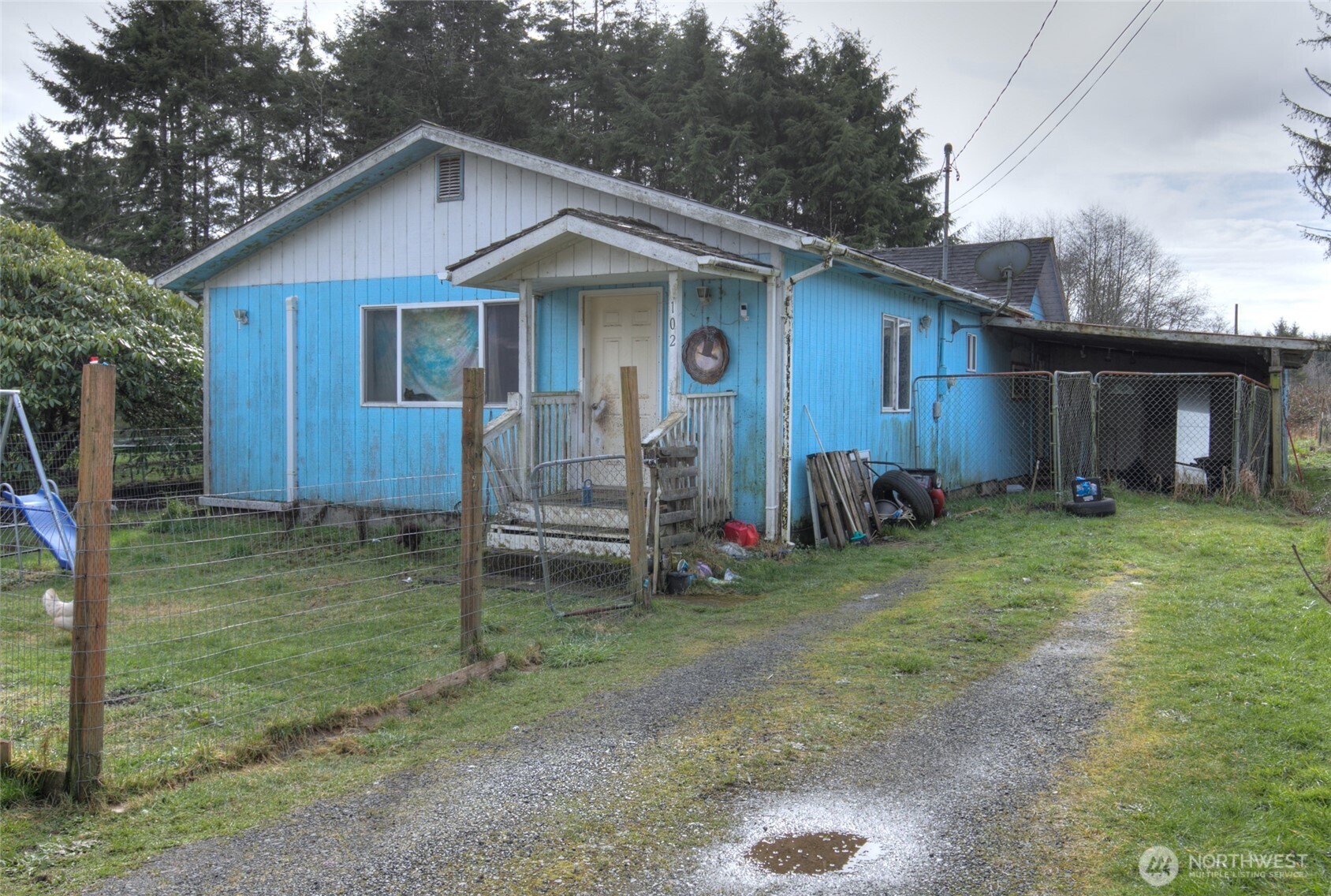 102 Elma Street Copalis Beach, WA 98535 - Photo 1 of 23 a backyard of a house with seating space