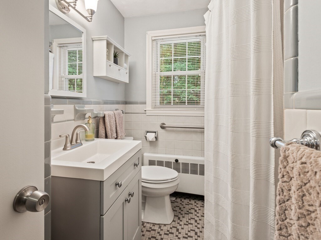 27 Whitla Drive Worcester, MA 01604 - Photo 14 of 38 a bathroom with a sink a toilet and a mirror