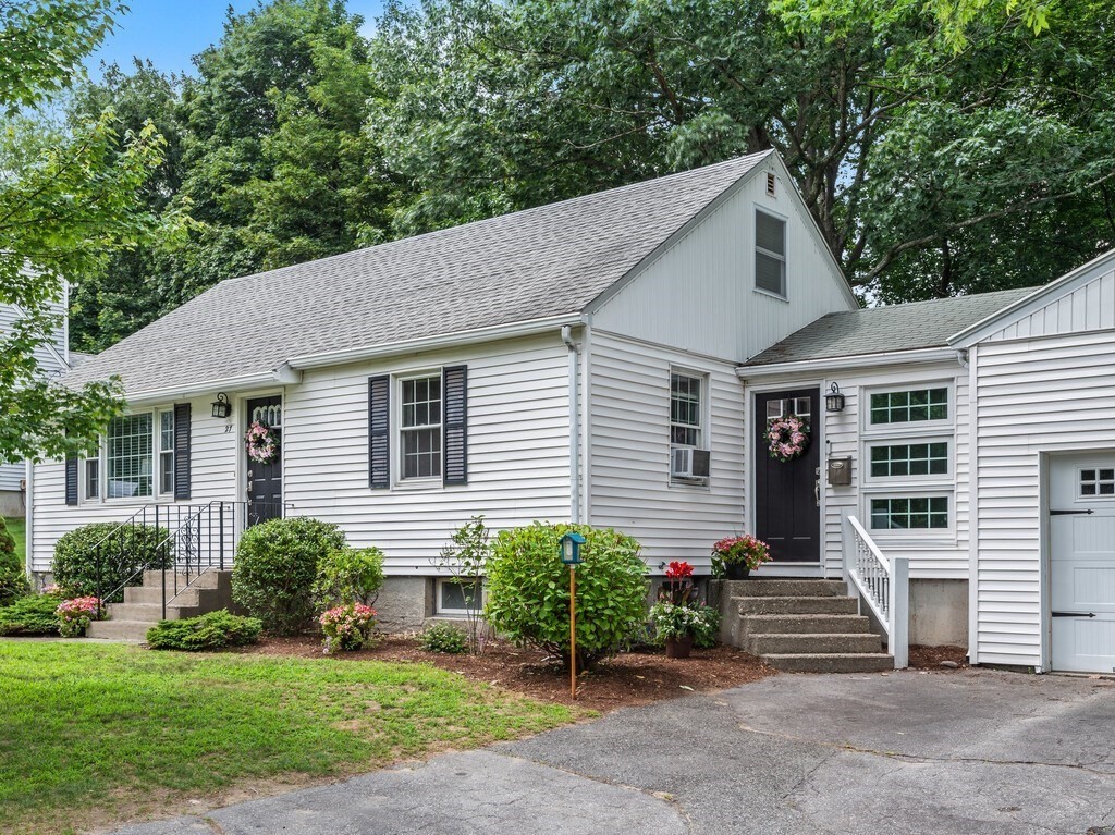 27 Whitla Drive Worcester, MA 01604 - Photo 2 of 38 a front view of a house with a garden