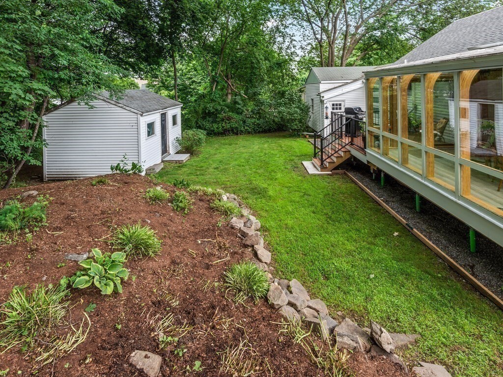 27 Whitla Drive Worcester, MA 01604 - Photo 29 of 38 a view of a backyard with a garden and plants