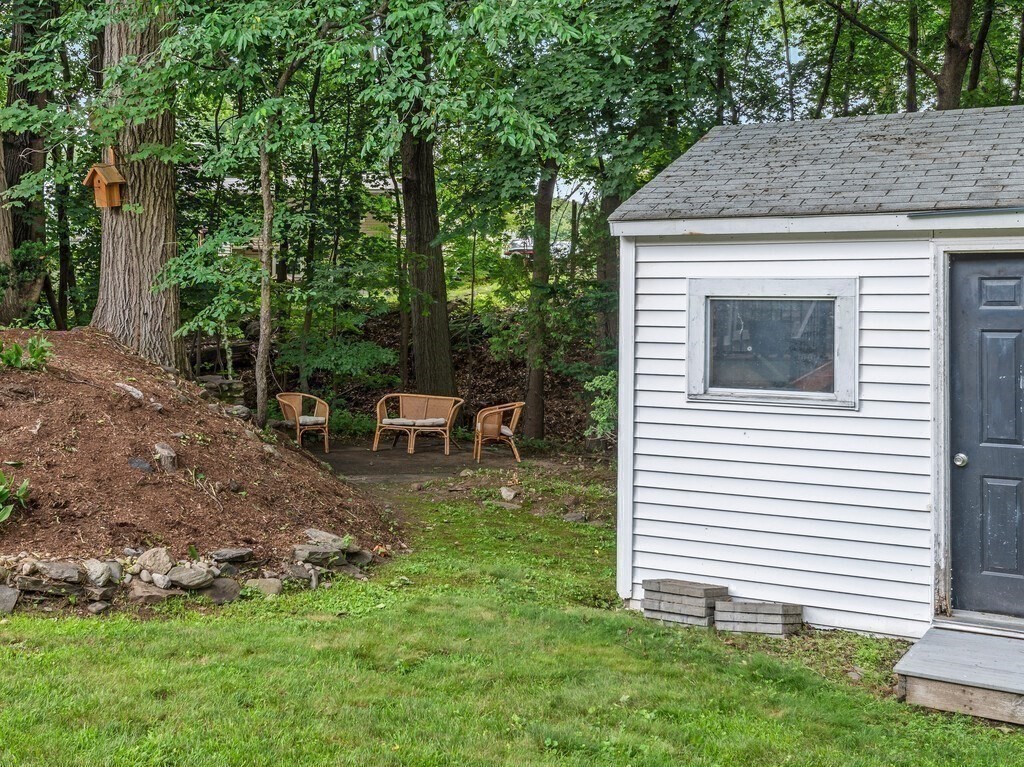 27 Whitla Drive Worcester, MA 01604 - Photo 30 of 38 a backyard of a house with table and chairs