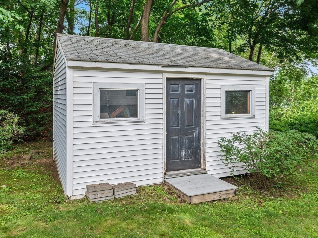 27 Whitla Drive Worcester, MA 01604 - Photo 36 of 38 a view of a house with a yard and plants
