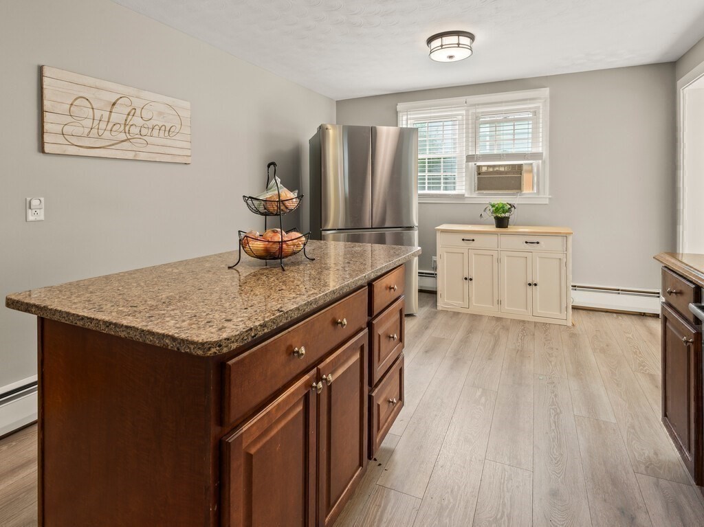 27 Whitla Drive Worcester, MA 01604 - Photo 9 of 38 a kitchen with stainless steel appliances granite countertop a sink stove and refrigerator
