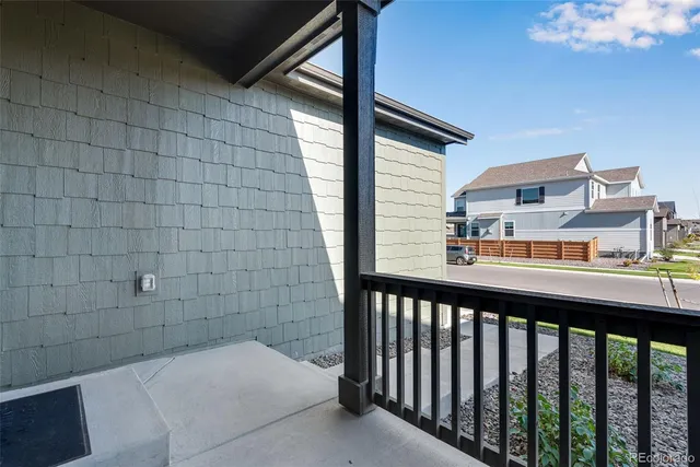 a balcony view with a seating space