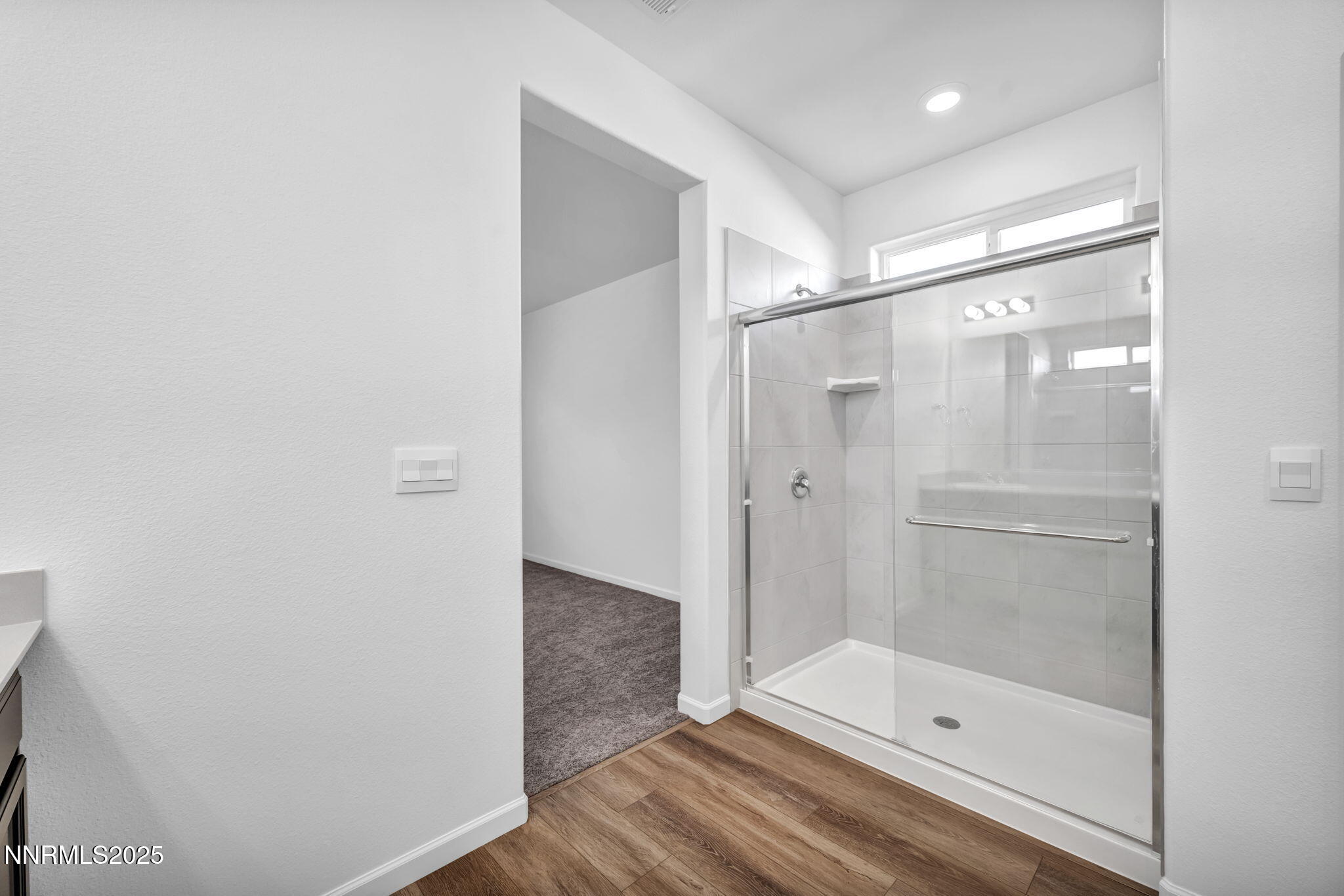 700 Kess Way Reno, NV 89506 - Photo 36 of 53 a bathroom with a glass shower door