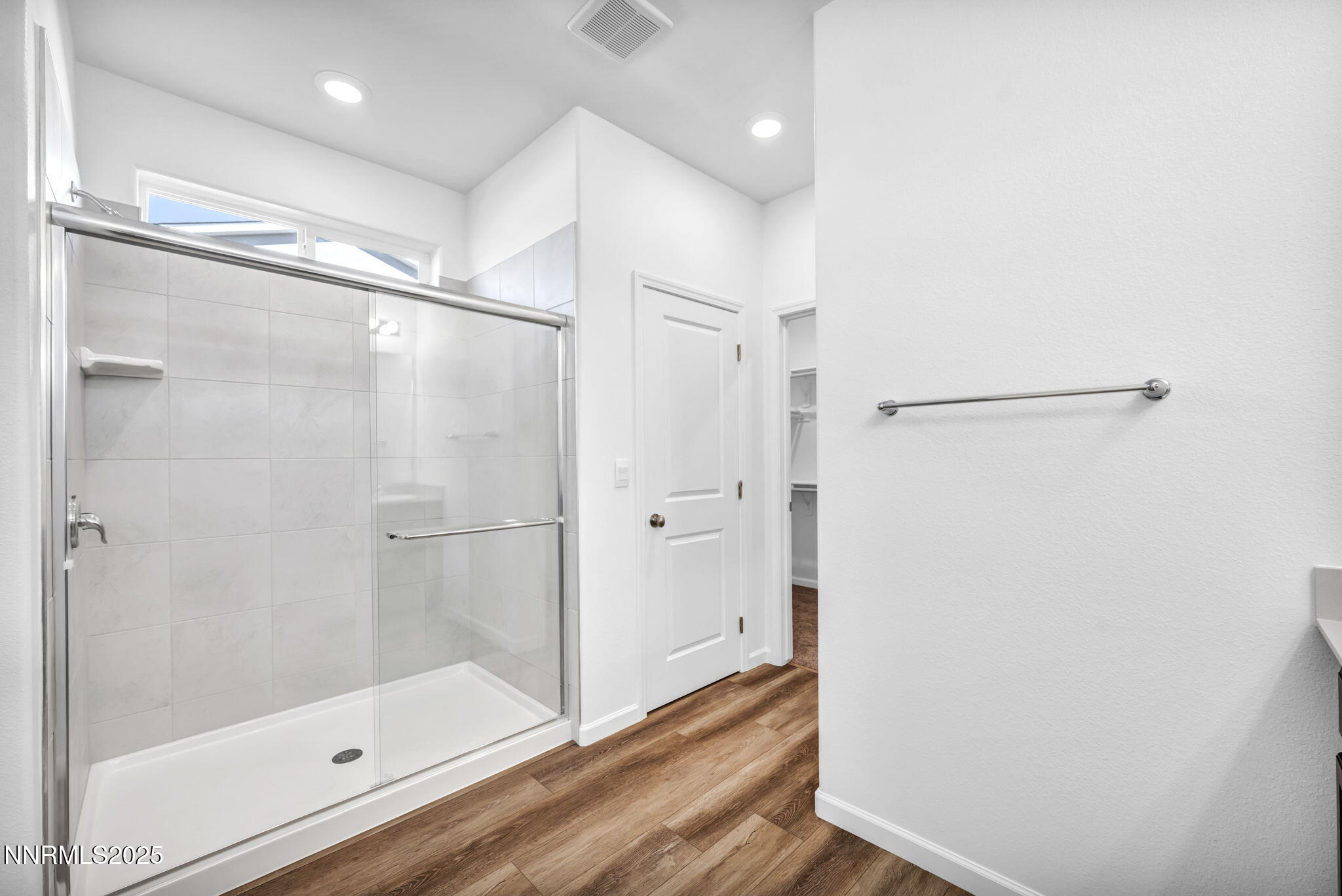 700 Kess Way Reno, NV 89506 - Photo 37 of 53 a bathroom with a glass shower door