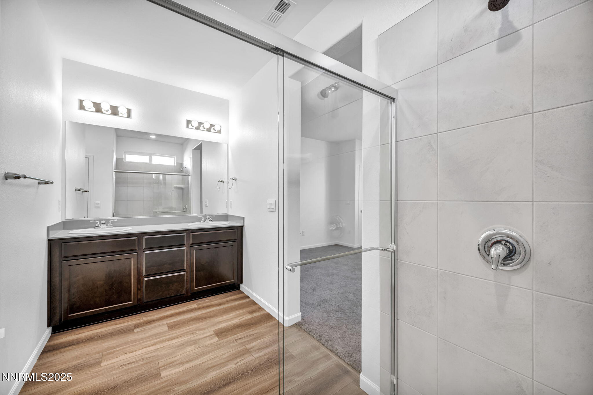 700 Kess Way Reno, NV 89506 - Photo 38 of 53 a bathroom with a granite countertop sink a mirror and shower