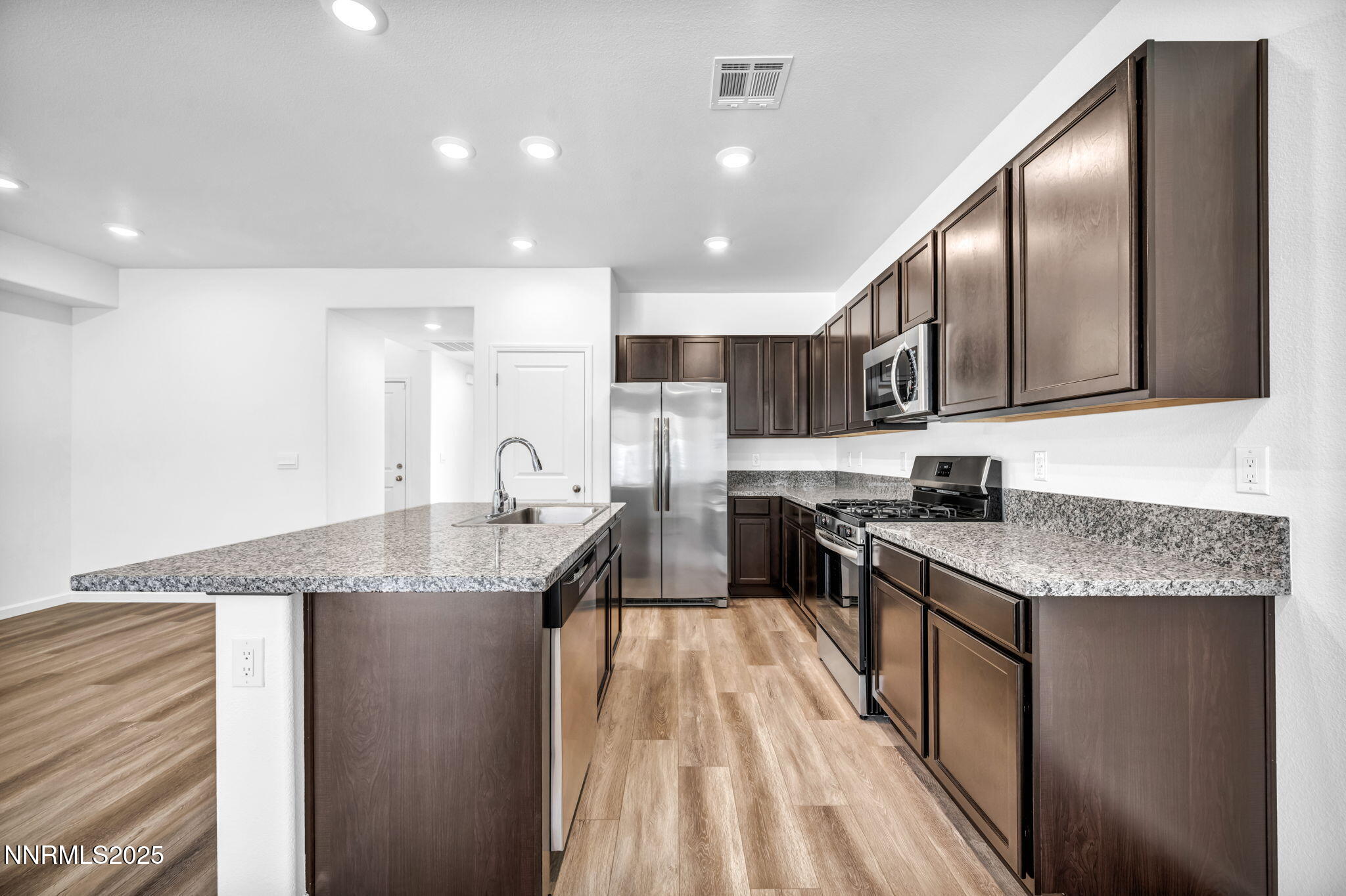 700 Kess Way Reno, NV 89506 - Photo 40 of 53 a kitchen with stainless steel appliances granite countertop a sink stove and refrigerator