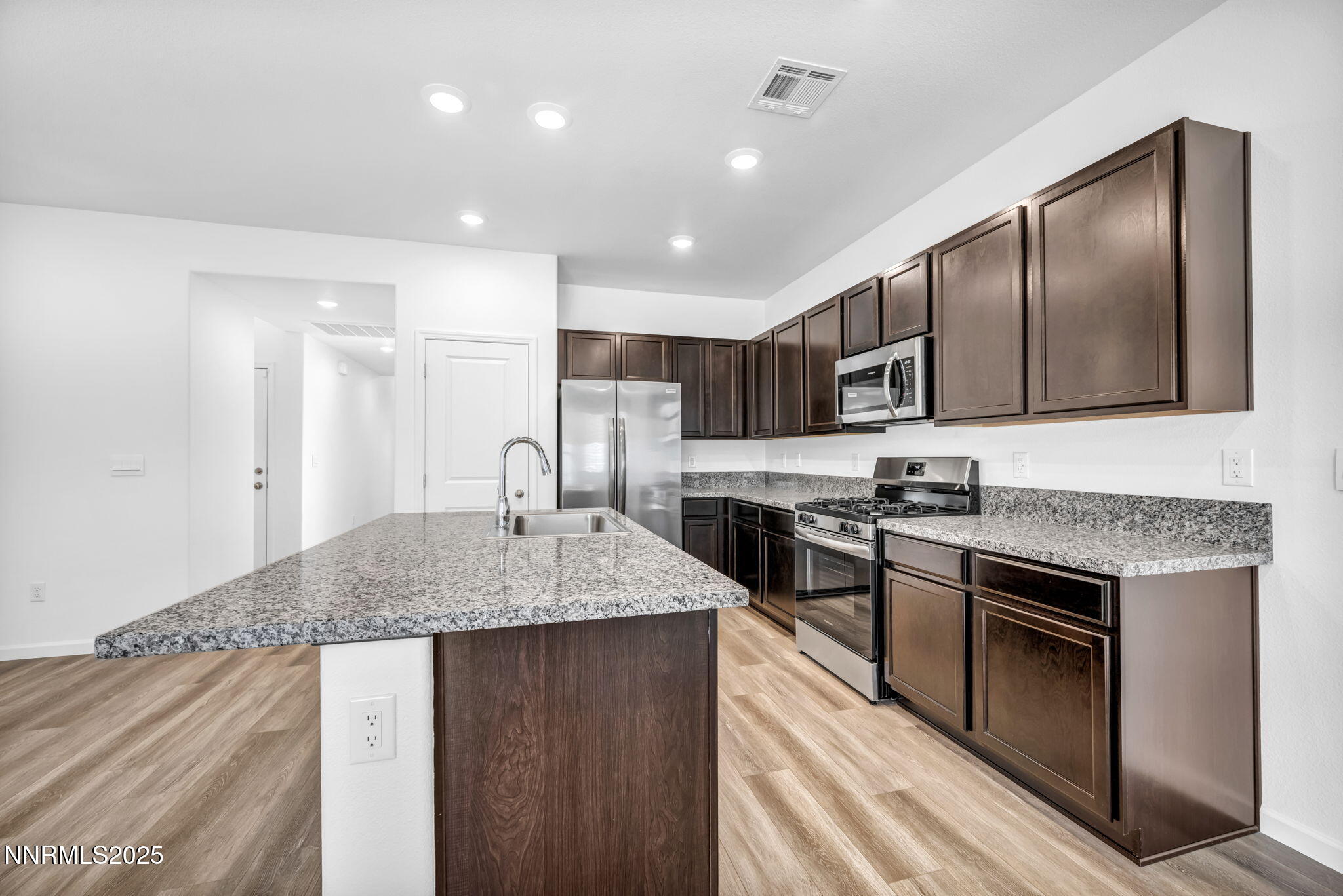 700 Kess Way Reno, NV 89506 - Photo 41 of 53 a kitchen with stainless steel appliances granite countertop a sink stove and refrigerator