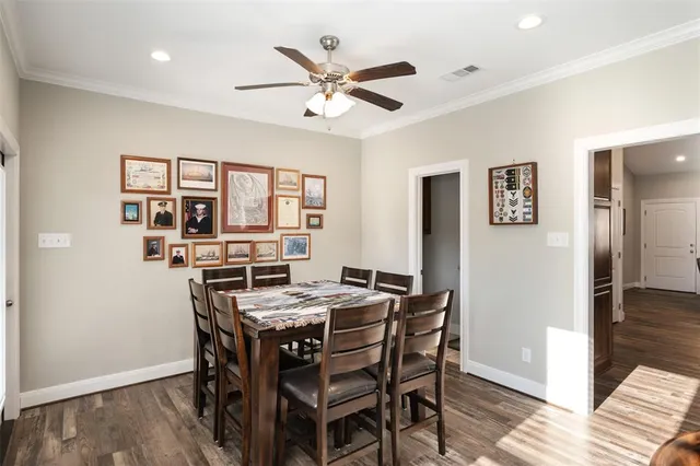 a dining room with furniture and window
