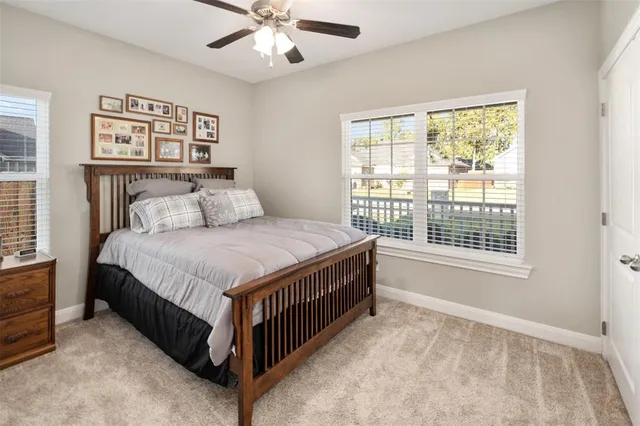 a spacious bedroom with a bed and a window