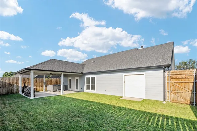 a view of a backyard with potted plants