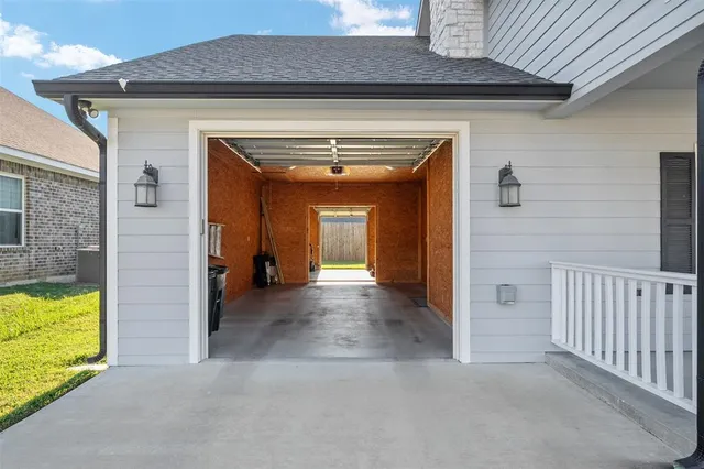 a view of a hallway with a bathroom