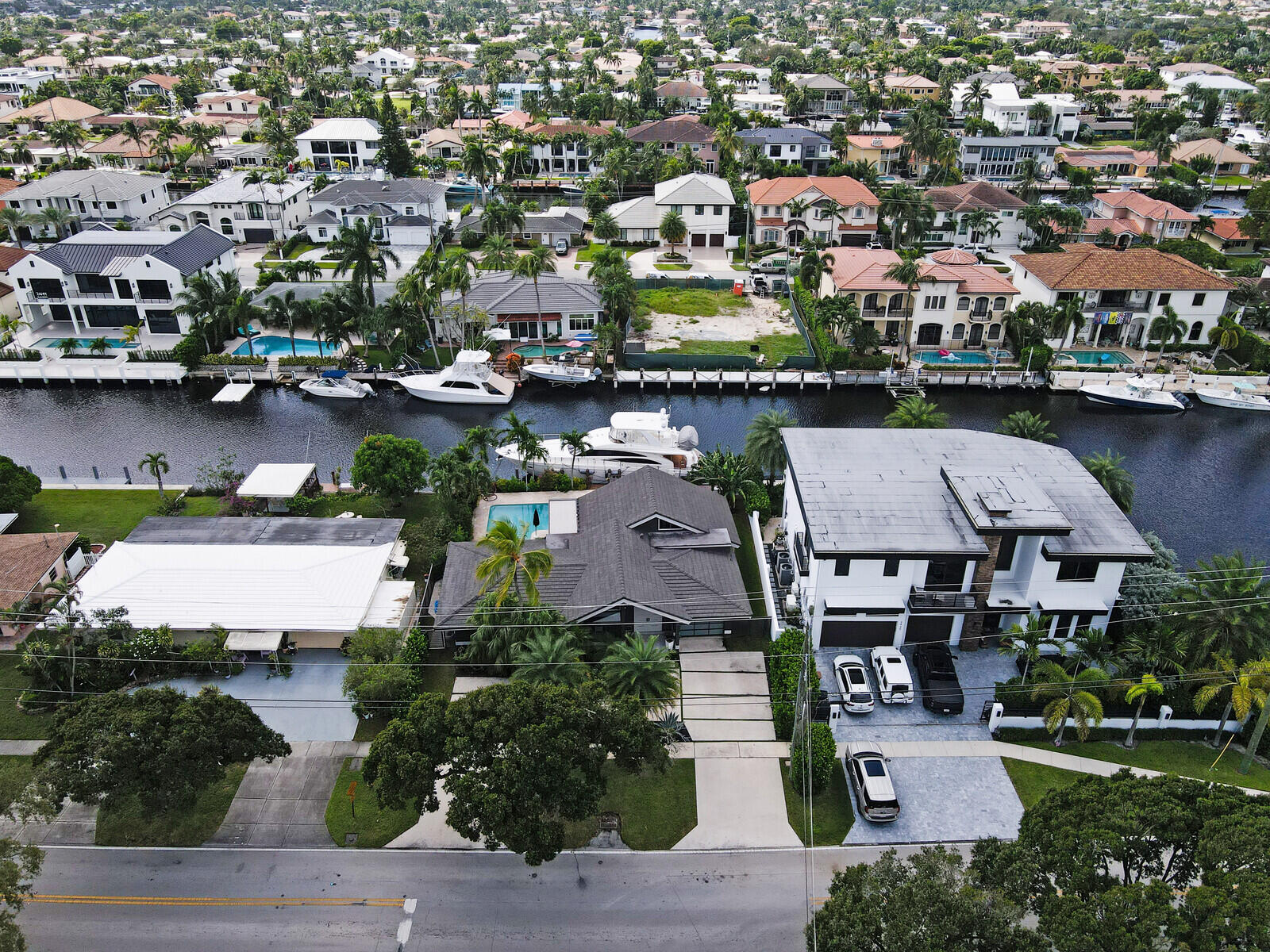 an aerial view of residential houses with yard