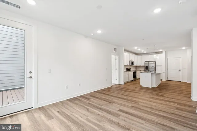a view of kitchen and kitchen with wooden floor