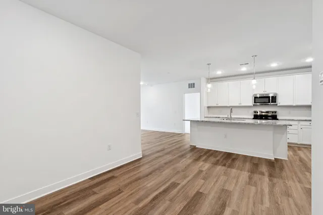 a view of kitchen with wooden floor