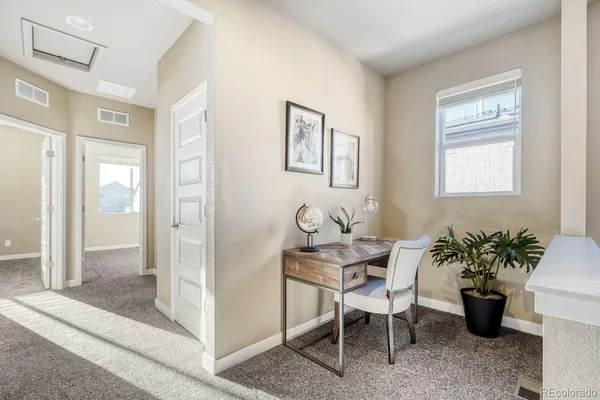 a workspace with furniture and window